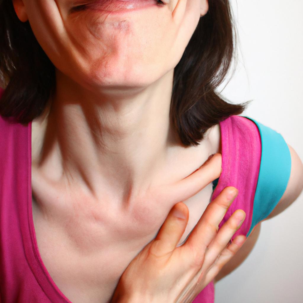 Person holding their chest, grimacing
